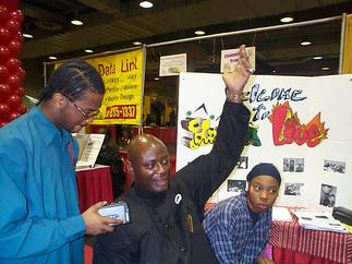 Khalid Muhammad raising his hand triumphantly